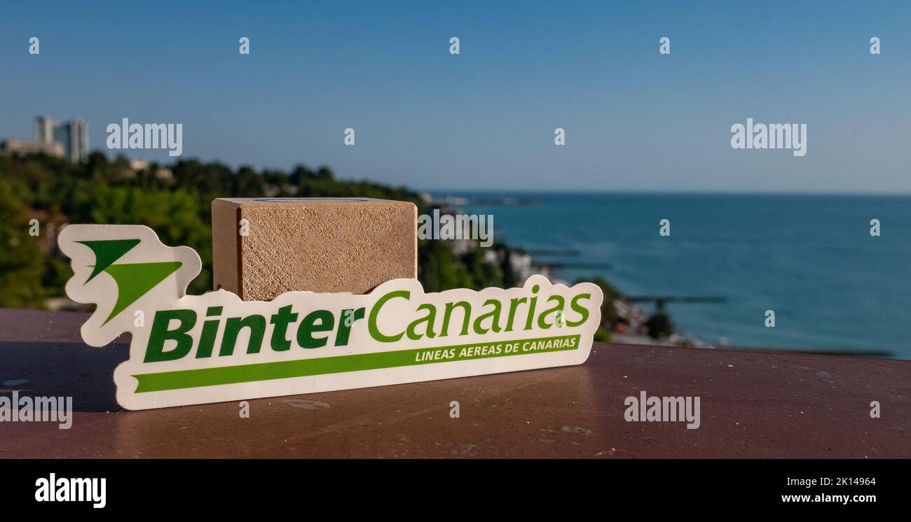 August 26, Sochi, Russia. The emblem of the Spanish airline Binter Canarias on the background of the embankment and the seashore in the resort town. Stock Photo