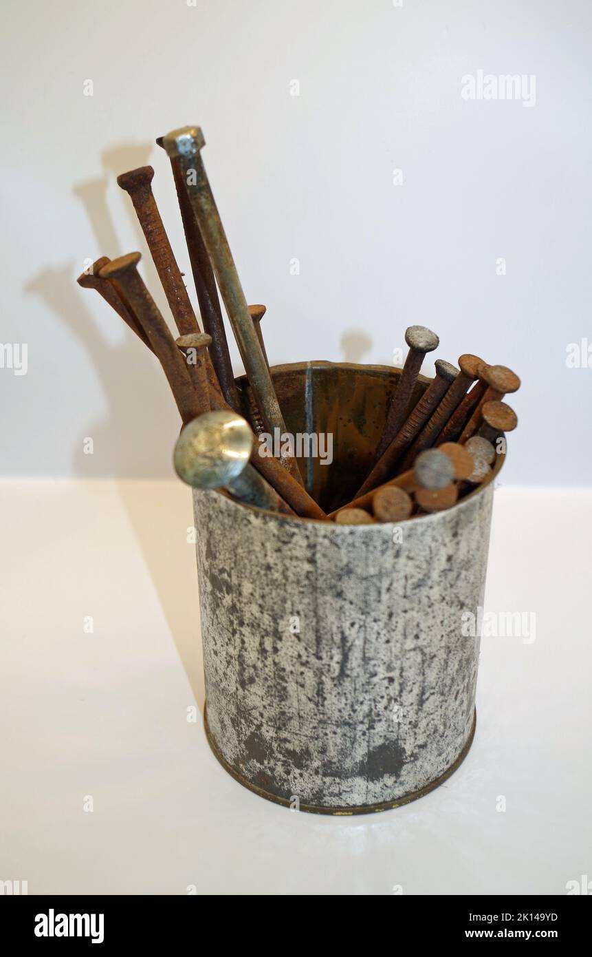 Rusty Nails in a can Stock Photo Alamy