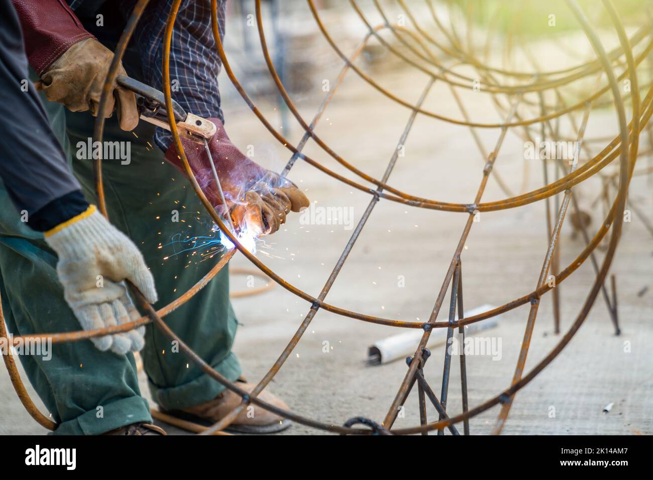 Blacksmith Technicians are welding several curve wires to form a ...