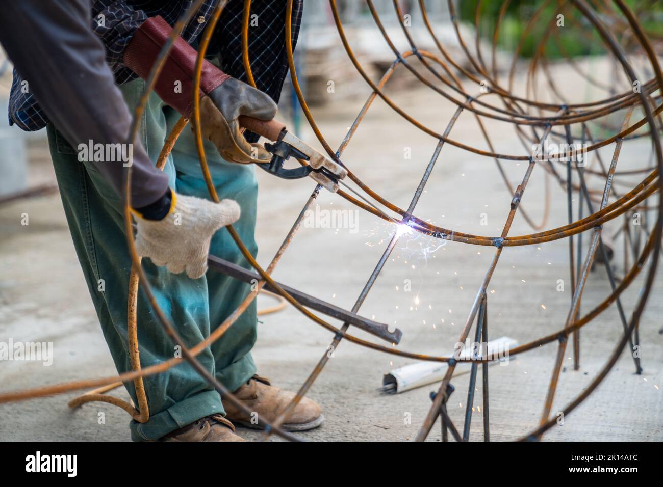 Blacksmith Technicians are welding several curve wires to form a ...