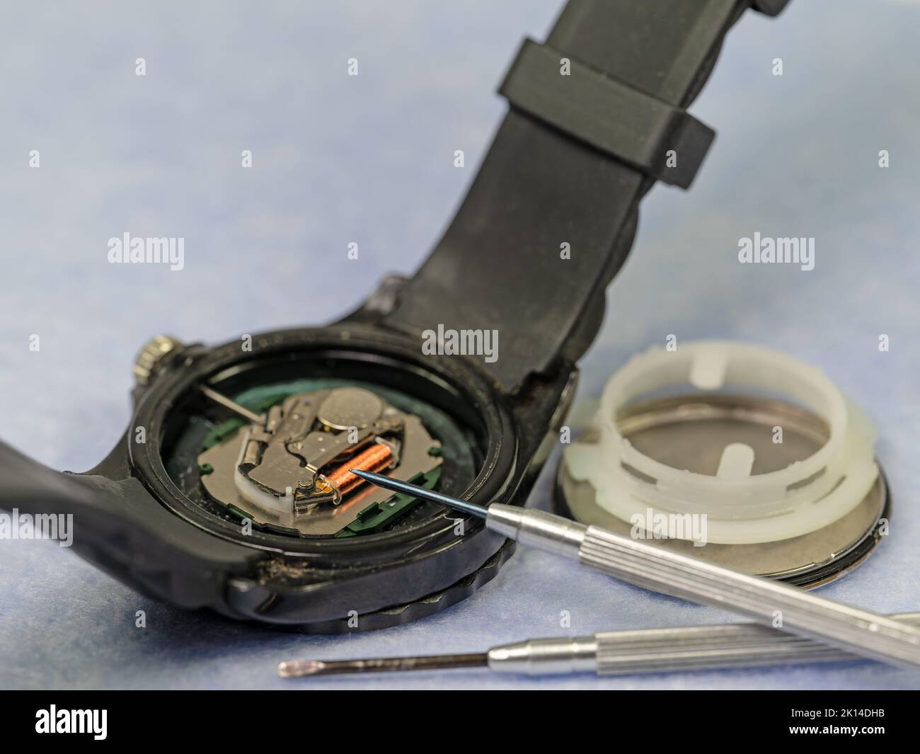 Open wristwatch shows its inner workings Stock Photo