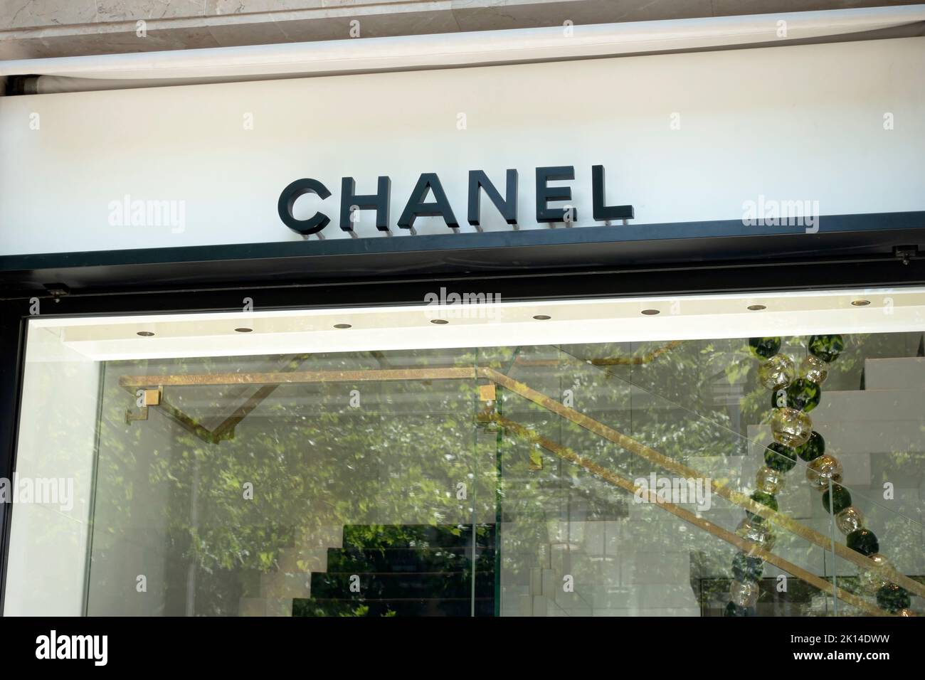 Barcelona, Spain - May 9, 2022. Chanel store sign on a wall. Chanel is a French luxury fashion house. Stock Photo