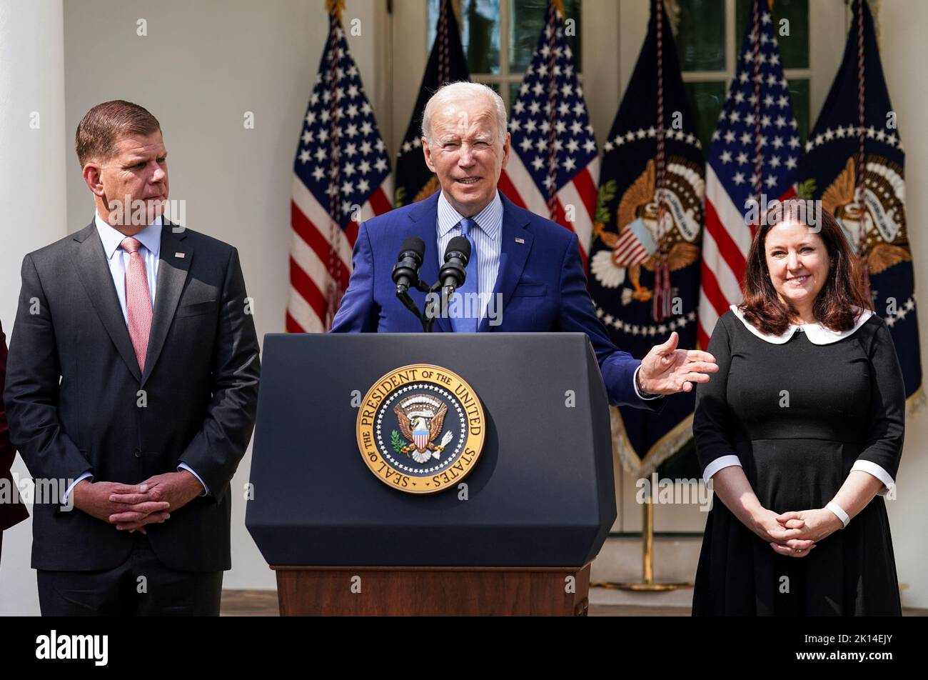 U.S. President Joe Biden is flanked by  Labor Secretary Marty Walsh and Celeste Drake, as Biden delivers remarks after U.S. railroads and unions secured a tentative deal to avert a rail shutdown, in the Rose Garden at the White House in Washington, U.S., September 15, 2022. REUTERS/Kevin Lamarque Stock Photo
