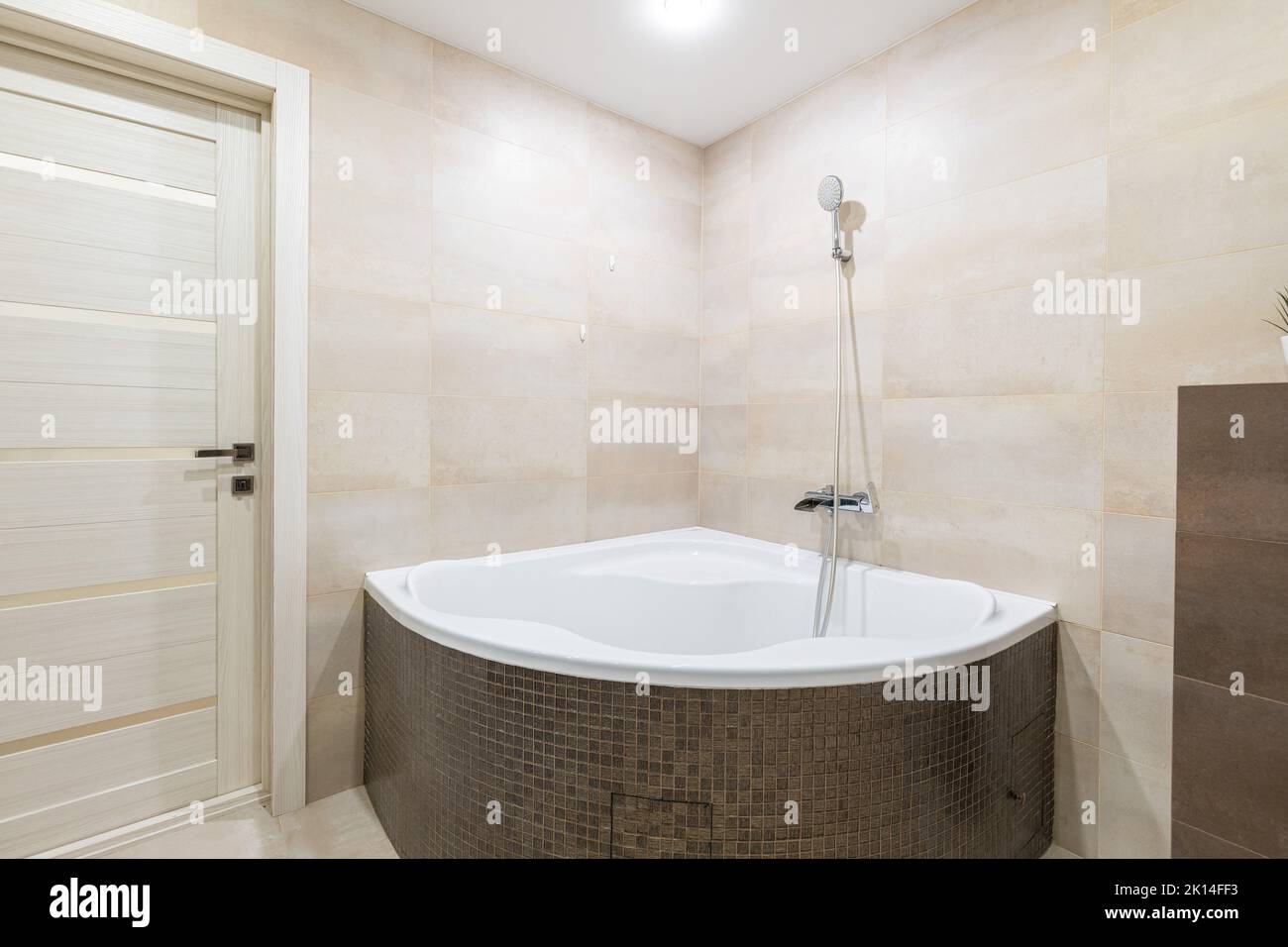 Jacuzzi and shower in the bathroom in the apartment Stock Photo