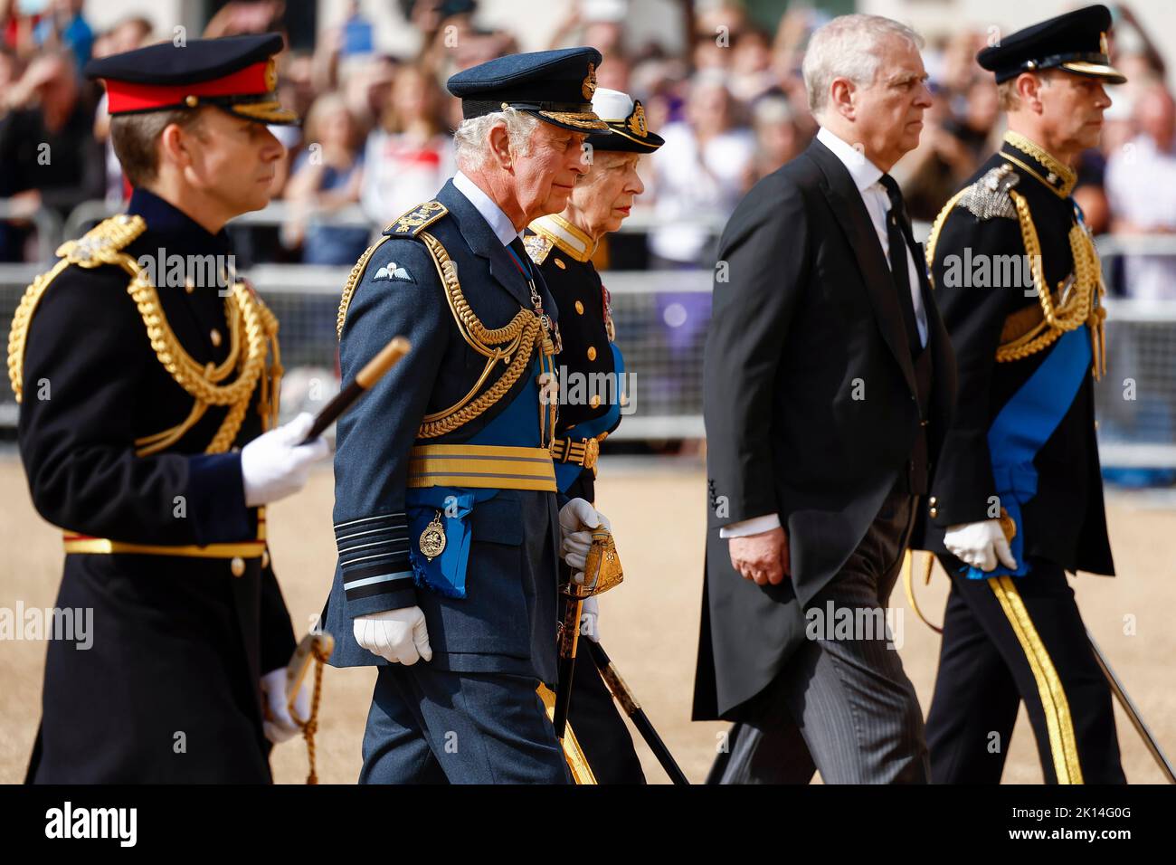 King Charles III and members of the royal family follow the coffin of Queen Elizabeth II, draped in the Royal Standard, as it is carried on a horse-drawn gun carriage of the King's Troop Royal Horse Artillery, during the ceremonial procession from Buckingham Palace to Westminster Hall, London, where it will lie in state ahead of her funeral on Monday. Picture date: Wednesday September 14, 2022. Stock Photo