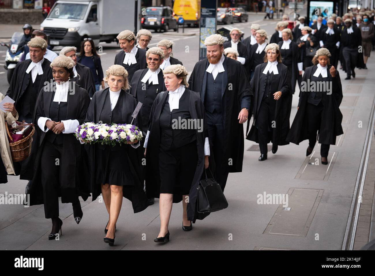 King's Counsel take part in a wreath laying after the death of the