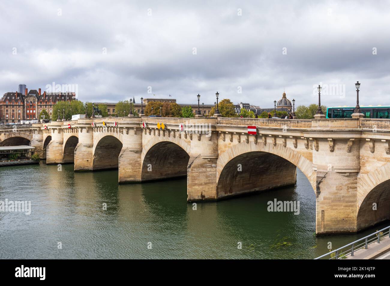 Landmark The Pont Neuf Bridge is the oldest standing bridge across the River Seine in Paris, France Stock Photo