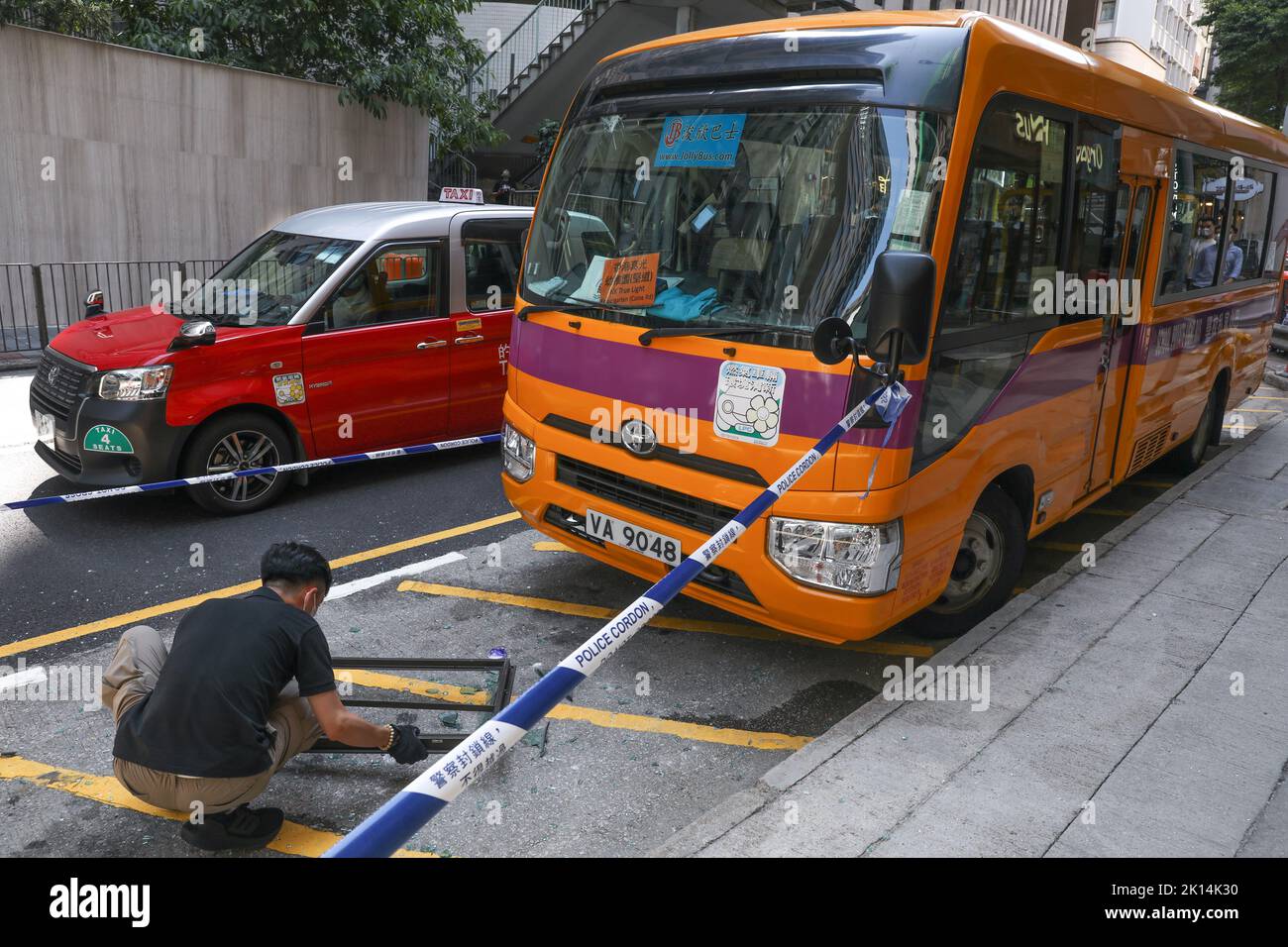 A window fell down from a residential building and hit a school bus and a woman was injured at 75 Caine Road, Central.08SEP22   SCMP/Yik Yeung-man Stock Photo