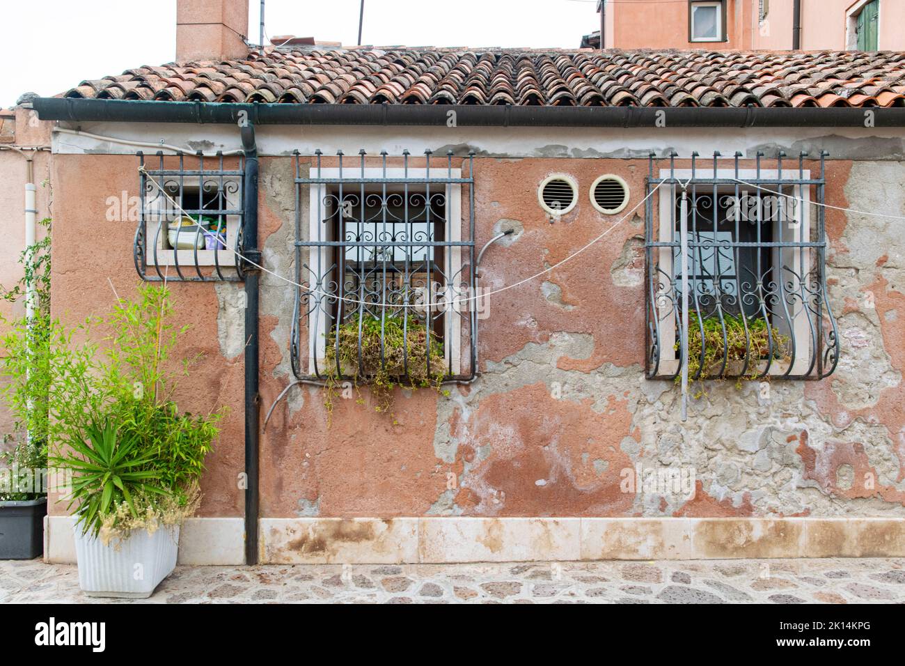an old and rusty facade at Giudecca Island, Venice Stock Photo