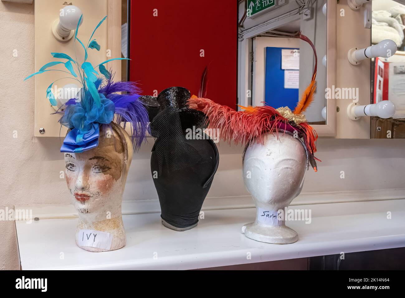 Chesil Theatre, in the former 12th century church of St Peter Chesil, in Winchester, Hampshire, UK. Mannequin heads with hats in the dressing room. Stock Photo