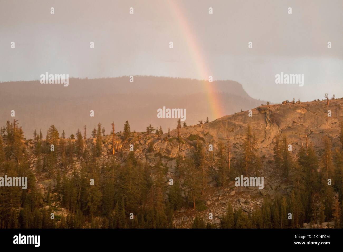 Thunderstorms in Yosemite National Park, like this one near Tenaya Lake and Olmsted Point, sometimes product rainbows. Stock Photo