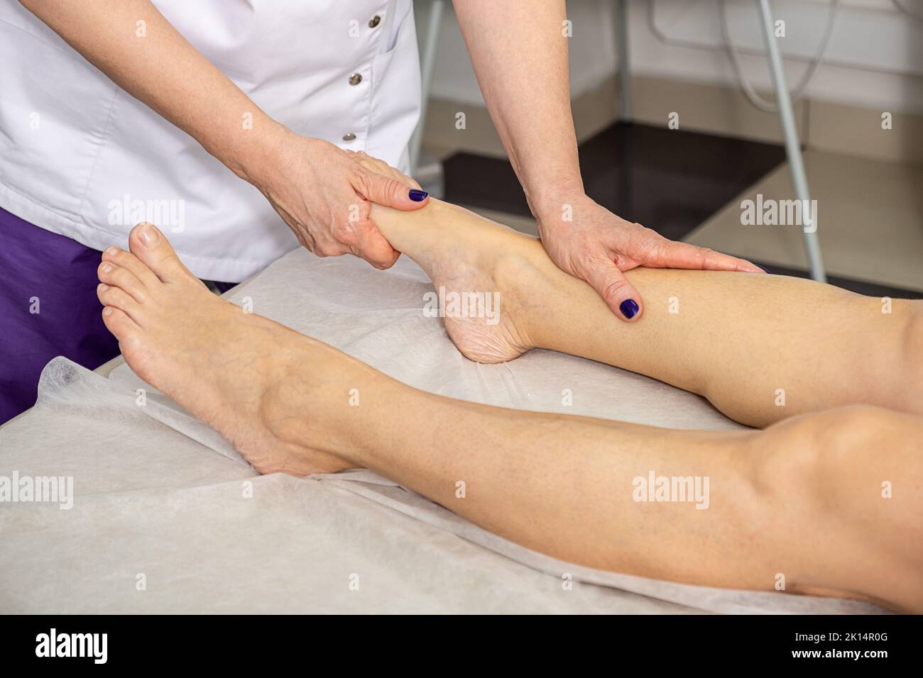 Foot massage in the spa salon. Body care concept Stock Photo