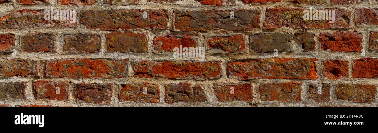 Wide weathered red brick wall background Stock Photo