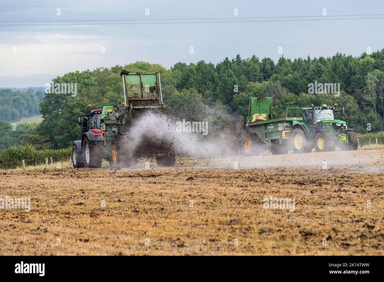 Modern agriculture. Muck spreading prior to ploughing Stock Photo - Alamy