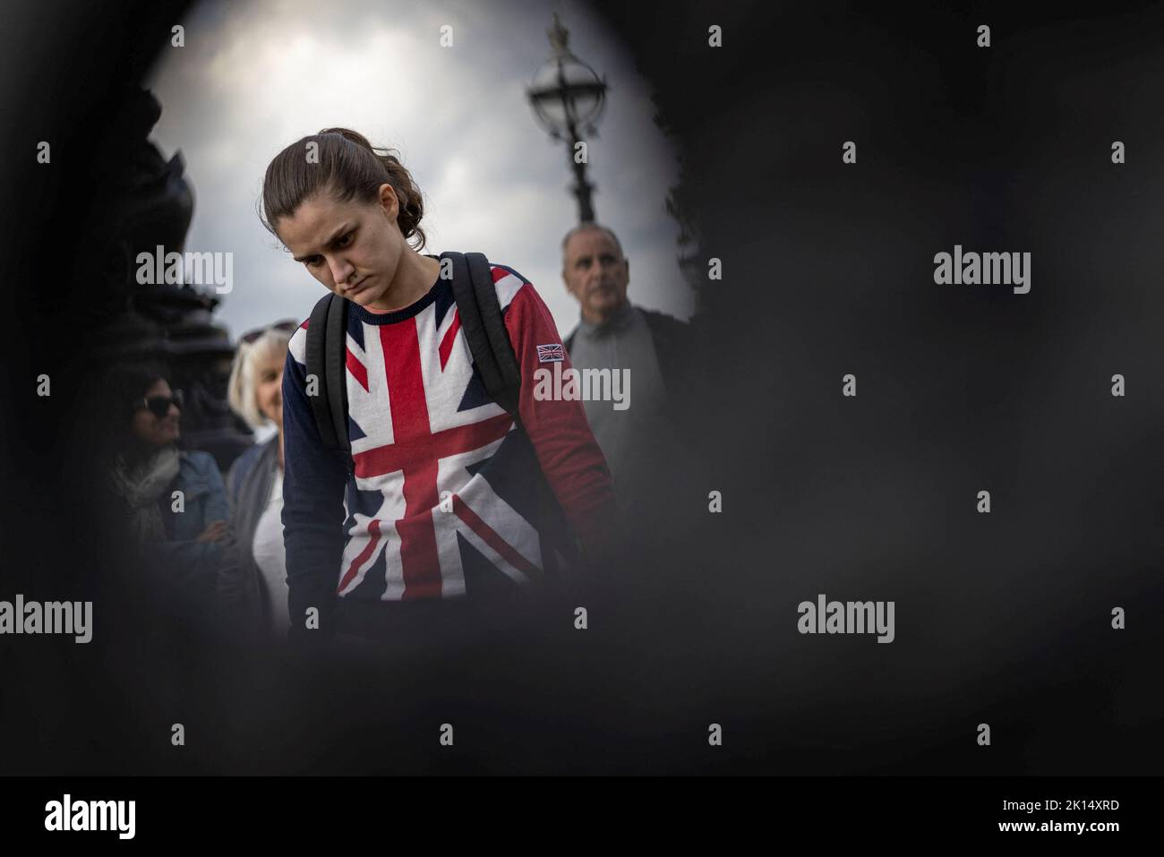 A woman stands in a queue to pay respect to Britain's Queen Elizabeth, following her death, in London, Britain September 15, 2022. REUTERS/Carlos Barria      TPX IMAGES OF THE DAY Stock Photo