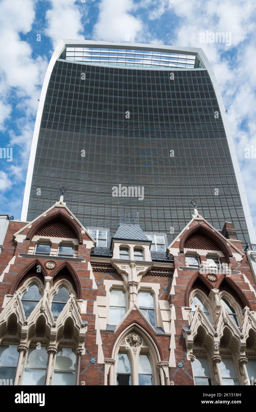 The Fenchurch Building, aka the Walkie Talkie, looms over the Gothic style grade ll listed building at 35 Eastcheap, London, England, UK. Stock Photo