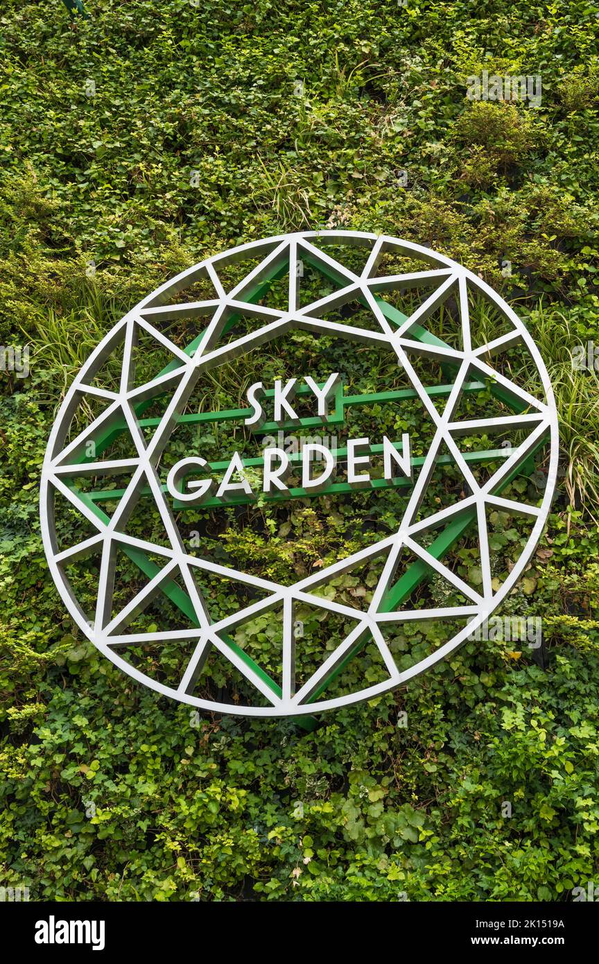 Stylised logo sign mounted on a living biophilic wall at the Sky Garden entrance to the Fenchurch Street building. City of London, England, UK Stock Photo