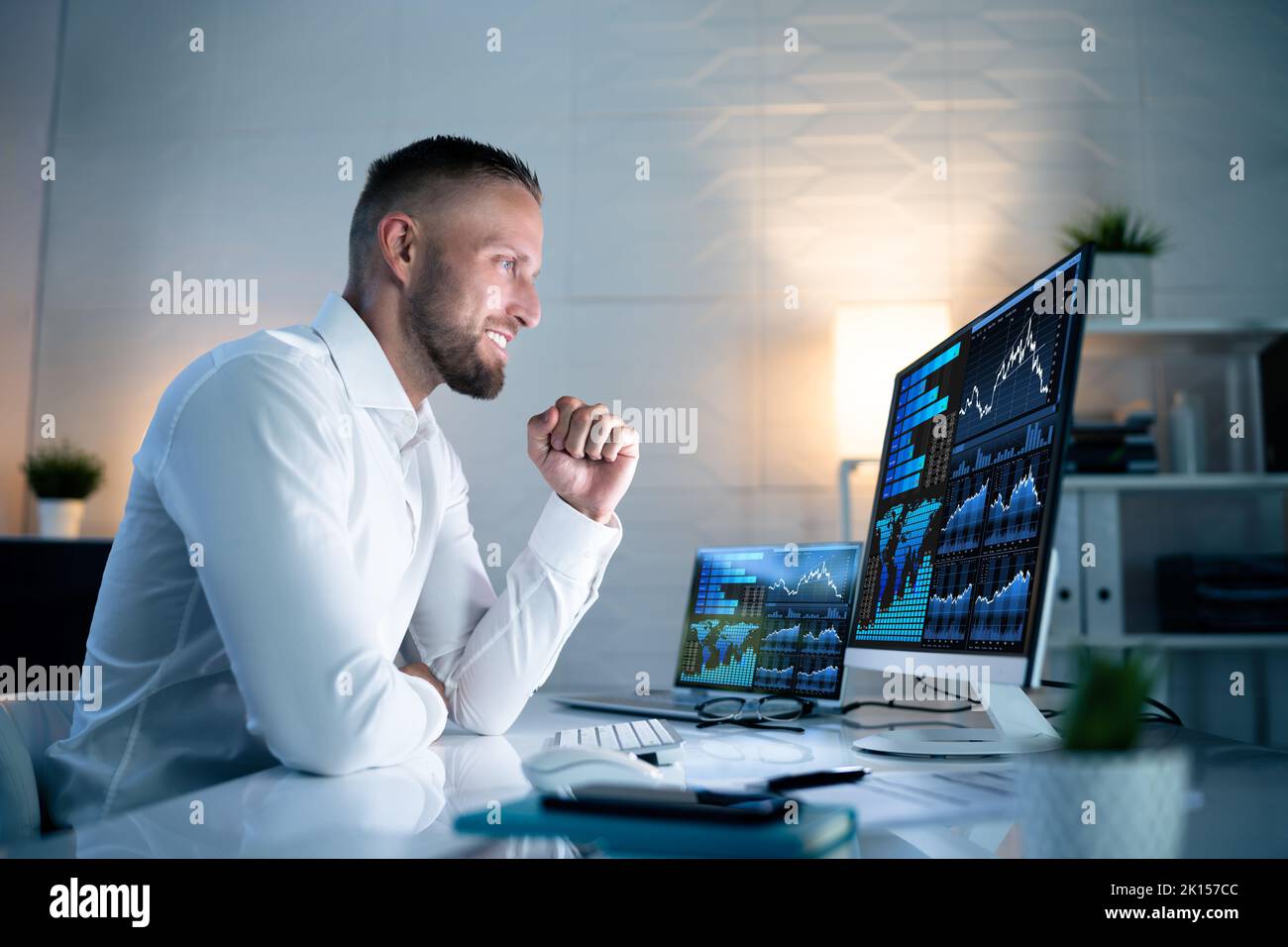 Excited Business Analyst Using Data Dashboard On Computer And Celebrating Win Stock Photo