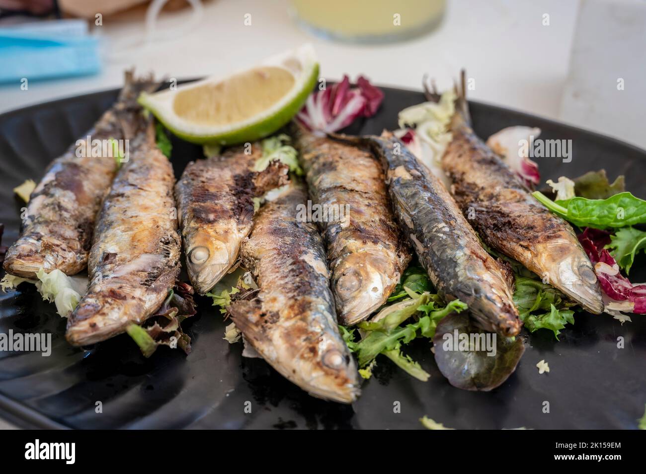 A plate of just grilled sardines, served in a Spanish restaurant Stock Photo Alamy
