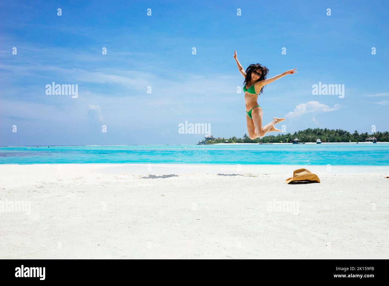 A woman jumping and posturing for the camera Stock Photo Alamy