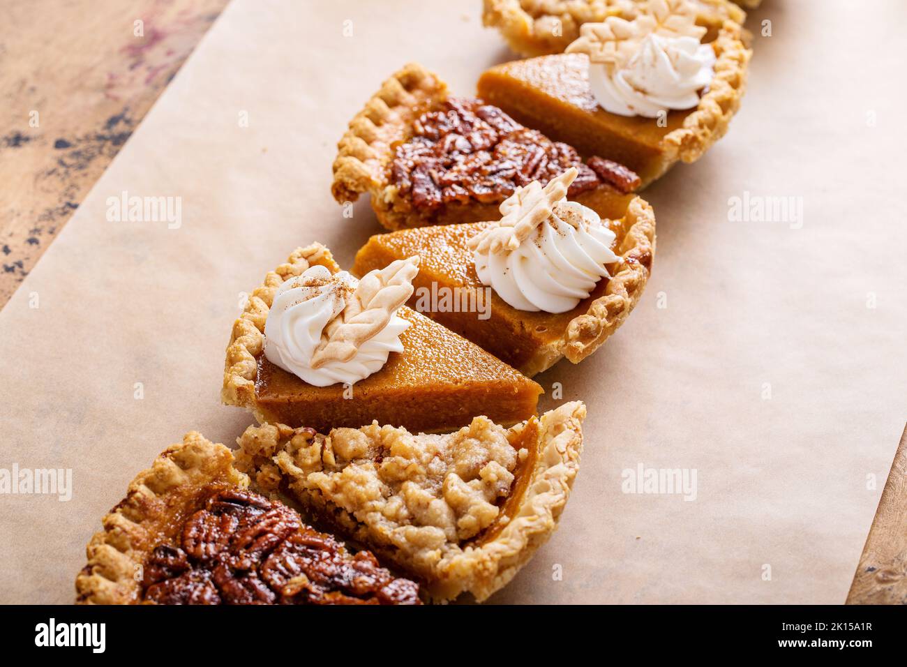 Traditional fall Thanksgiving pie slices, pumpkin and pecan pie Stock Photo