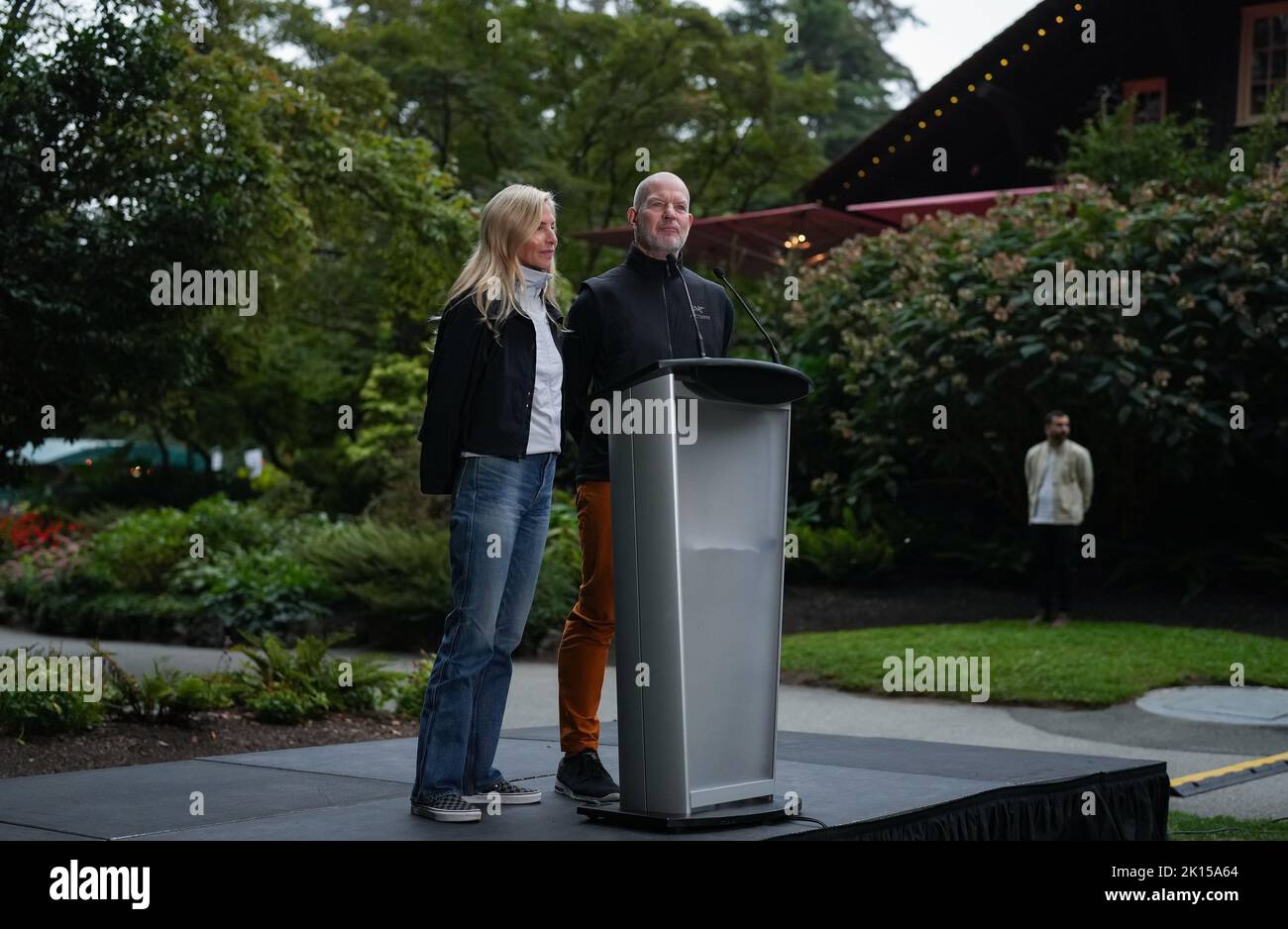 Lululemon founder Chip Wilson and his wife Summer Wilson speak after
