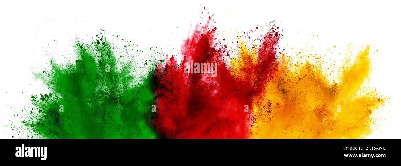 colorful cameroonian flag green red yellow color holi paint powder explosion on isolated white background. cameroon africa qatar celebration soccer tr Stock Photo