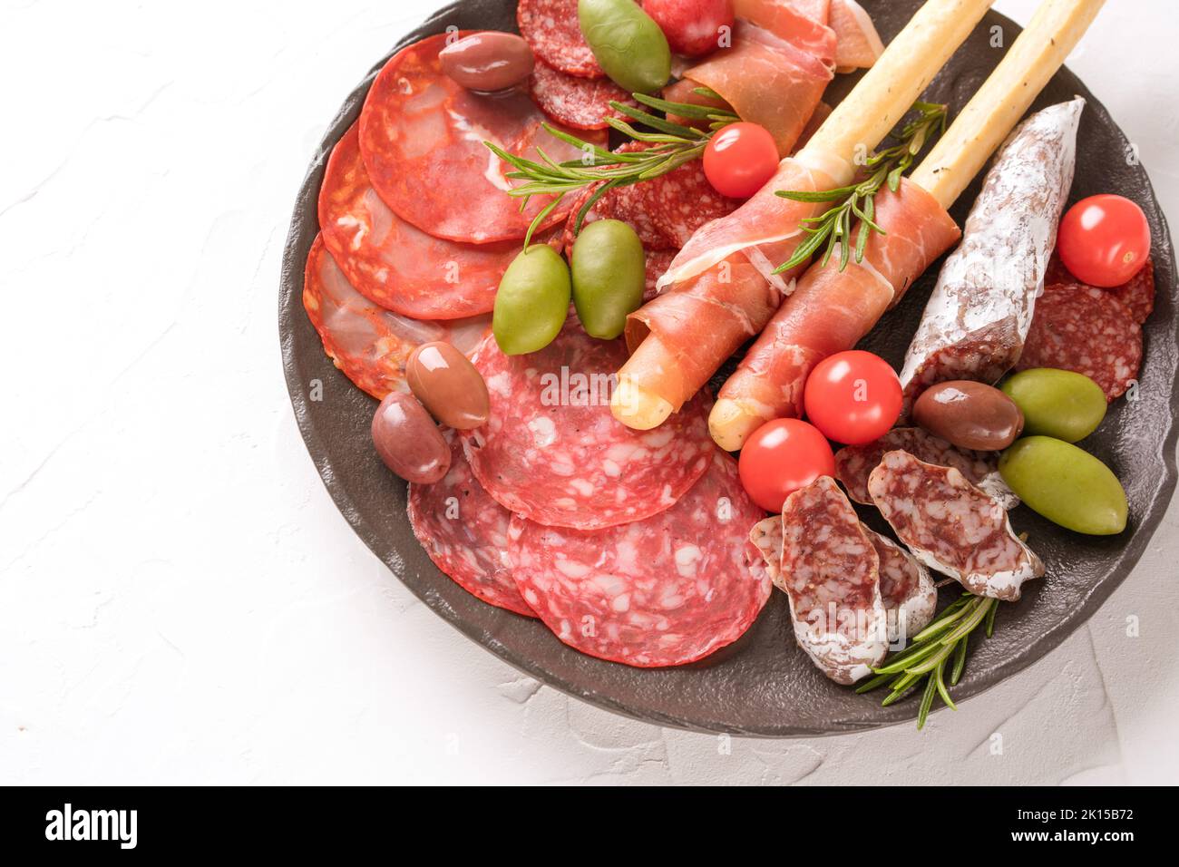 Charcuterie plate with variery of sausages salami, bresaola