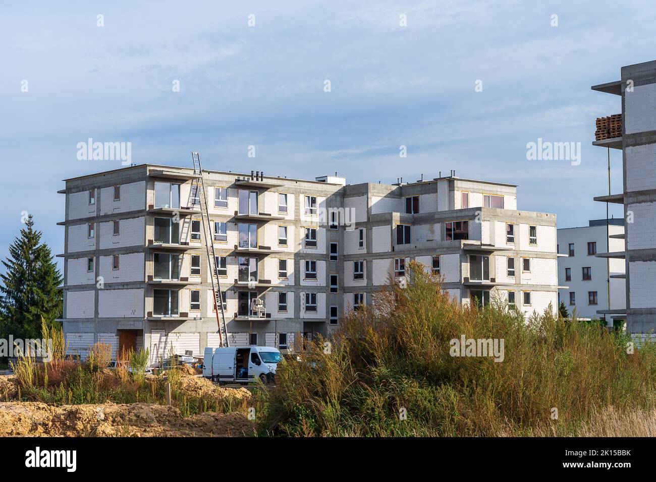 Construction of a housing estate with white walls.Estate under construction Stock Photo