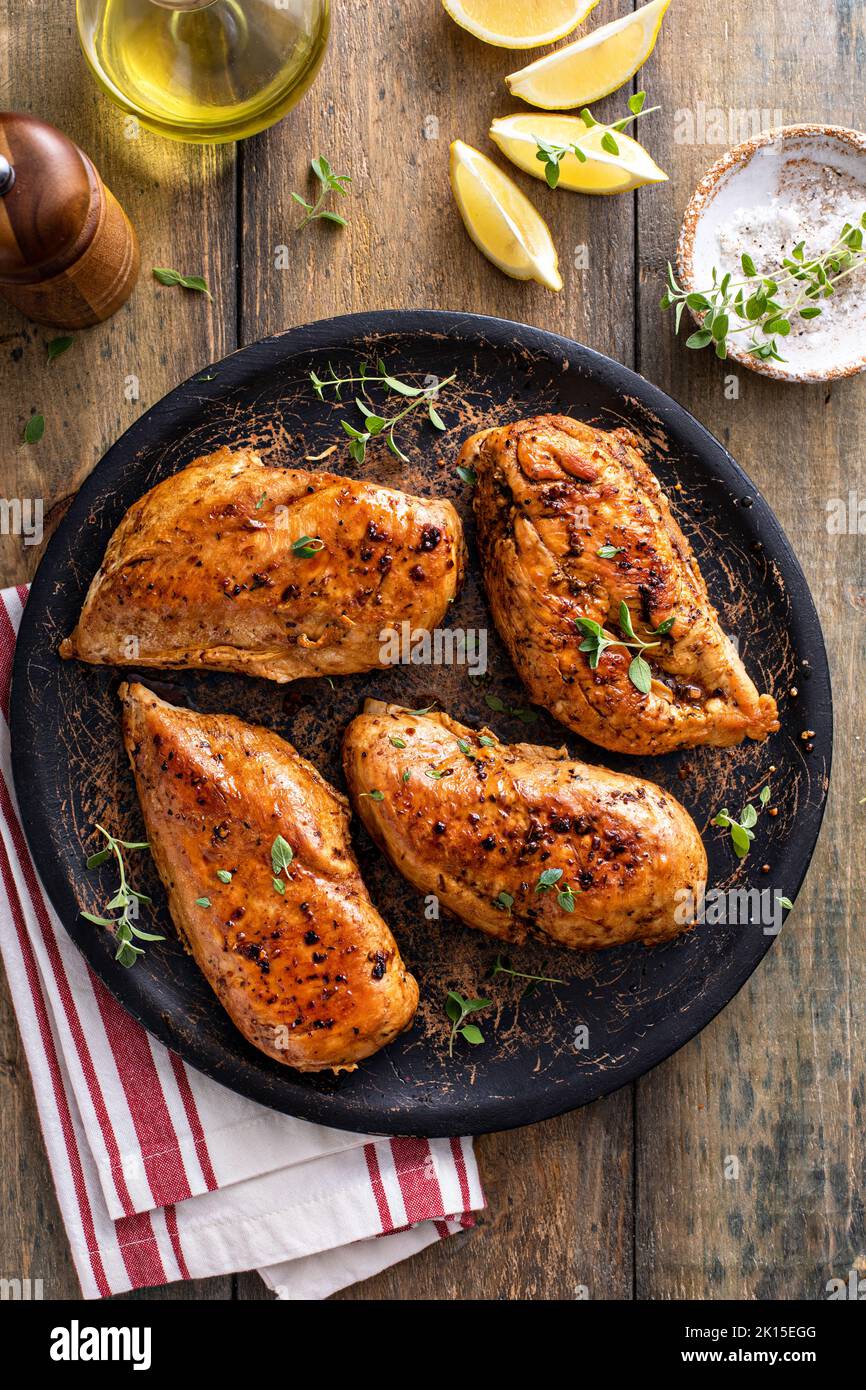Roasted or seared chicken breast with herbs Stock Photo