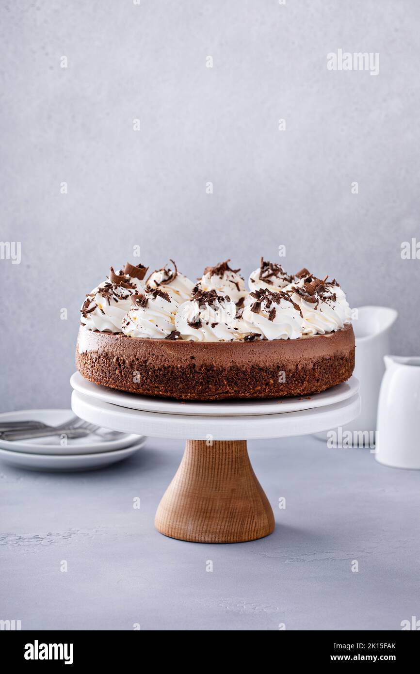 Chocolate cheesecake with whipped cream and chocolate shavings Stock Photo