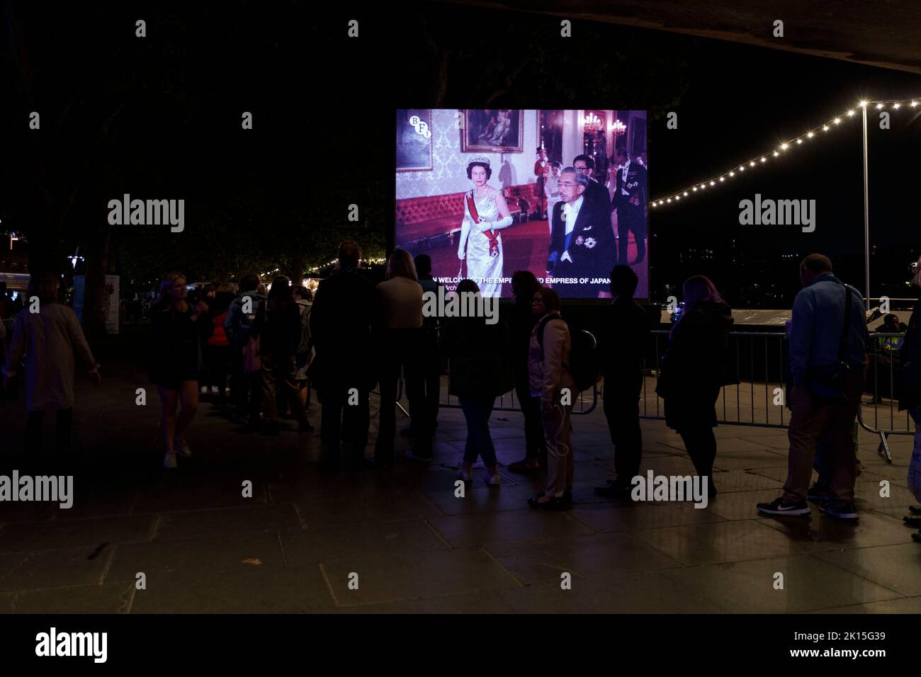 London, UK. 14th Sep, 2022. An outdoor screen showing Queen Elizabeth II along the queue at Southbank as members of the public queue to see the coffin of Queen Elizabeth II as it lays in State inside Westminster Hall, at the Palace of Westminster. Members of the public are able to pay respects to Her Majesty Queen Elizabeth II for 23 hours a day from September 14, 2022. A long queue is set to stretch 10 miles across London and a million people are expected to join for the Lying-in-State of Queen Elizabeth II at the Palace of Westminster in the next few days until the funeral at Stock Photo