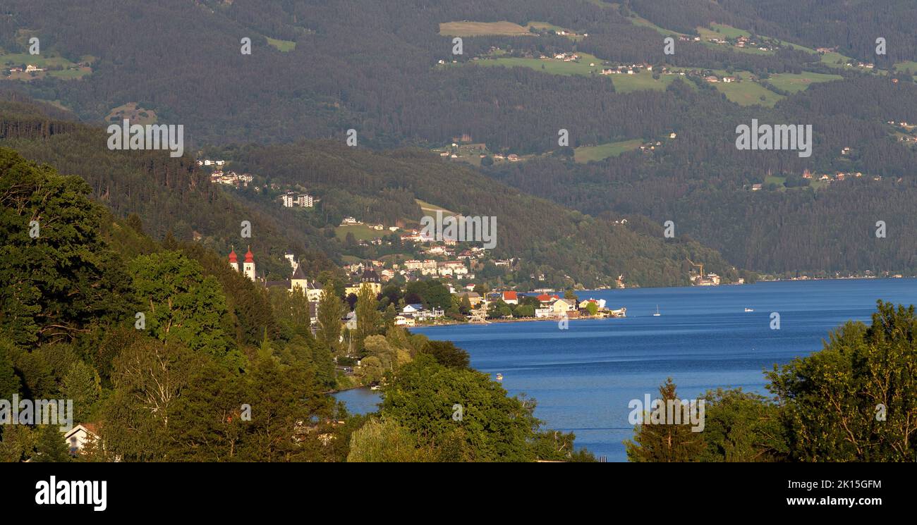 Landscape of Millstat city on Austrian lake Millstatter see in summer time, famous for spa resort and cycling ruts Stock Photo