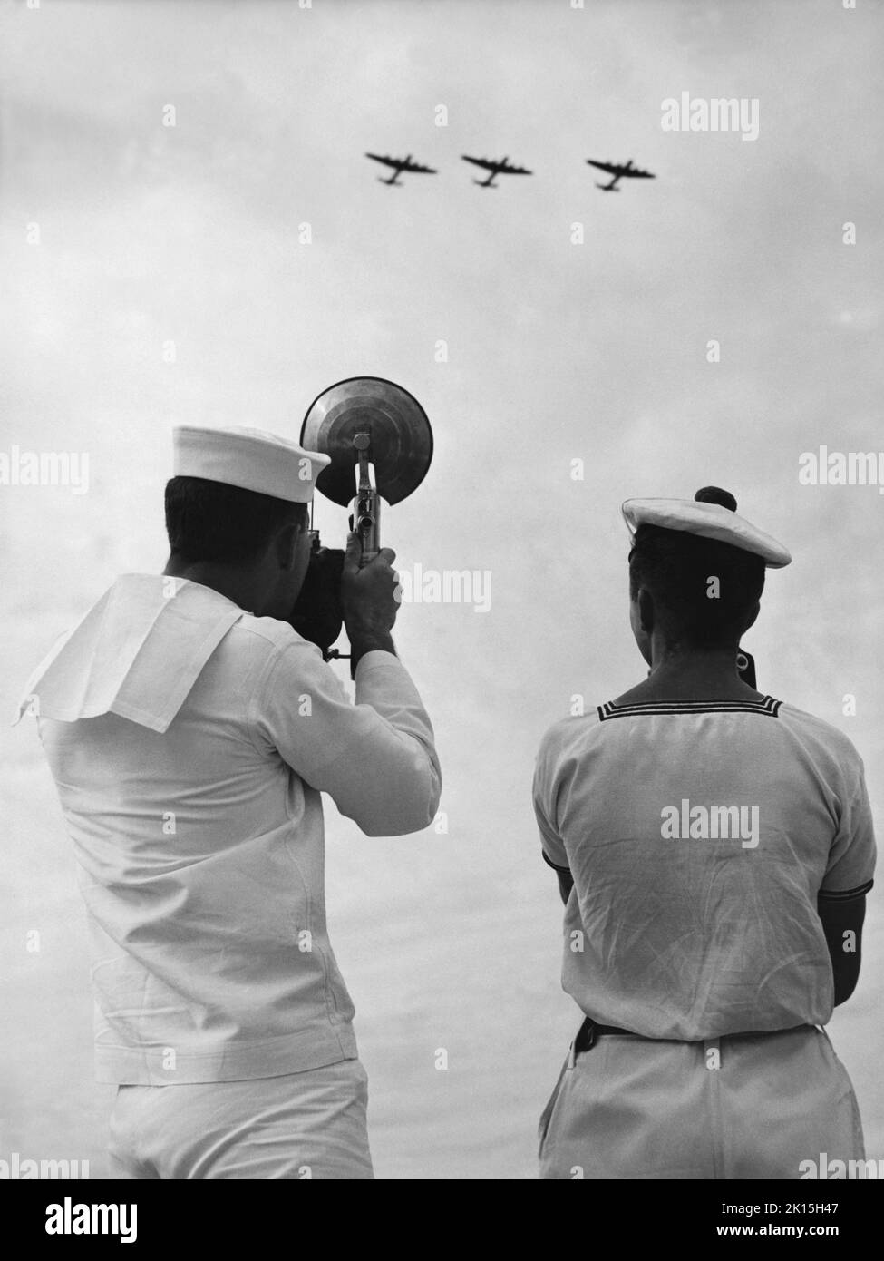 October 16th, 1952 image of members of the American and French Navies photographing planes at Port Lyautey, (Kenitra), Morocco. Stock Photo
