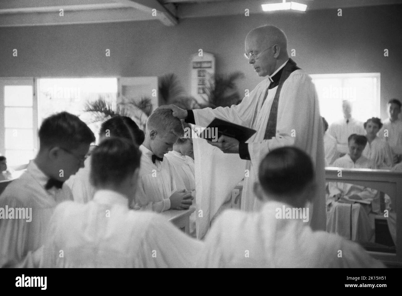 A Presbyterian minister confirming teens, 1952. Stock Photo
