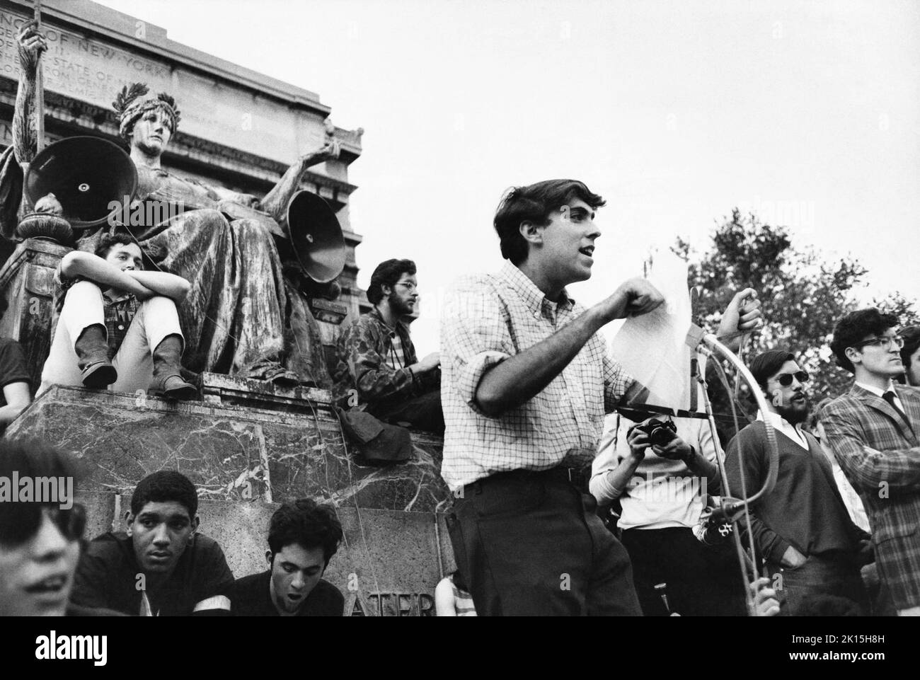 Mark Rudd speaks to students assembled in front of Columbia University's Law Library, announcing that protesters had occupied a tenement that afternoon. Rudd would go on to be part of the Weather Underground. Stock Photo