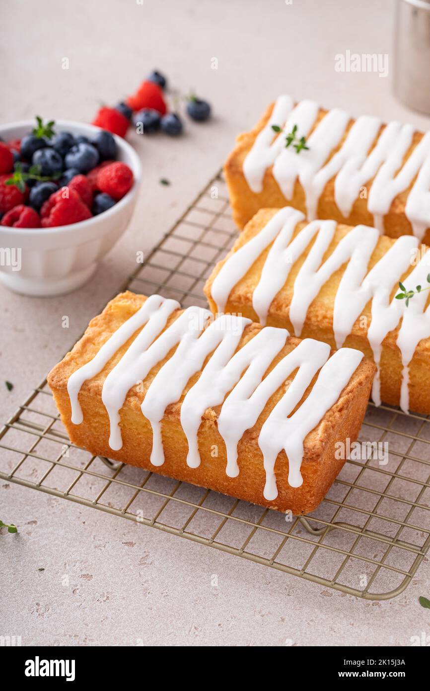 Classic pound cake with powdered sugar glaze dripping over Stock Photo