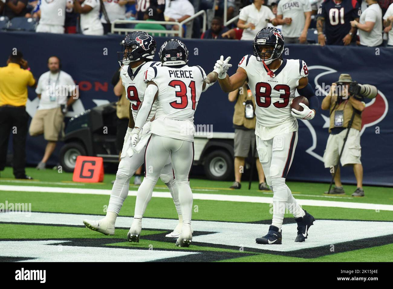 Houston, Texas, USA. September 11, 2022: Houston Texans tight end O.J.  Howard (83) spikes the ball after scoring on a 16-yard touchdown catch  during an NFL game between the Texans and the