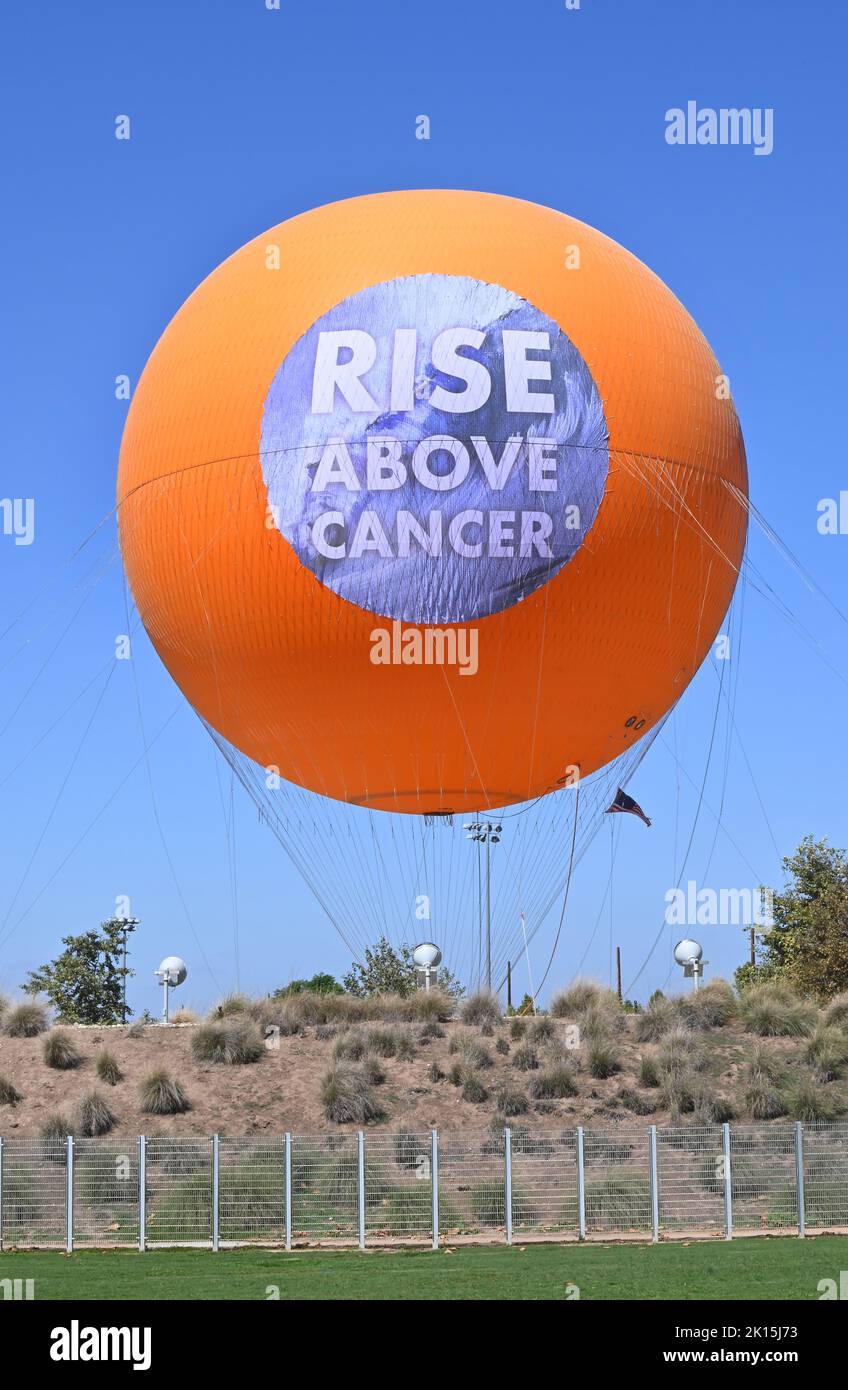 IRVINE, CALIFORNIA - 13 SEPT 2022:  The Great Park Balloon with a Rise Above Cancer banner celebrating the opening of the City Of Hope Cancer Center. Stock Photo
