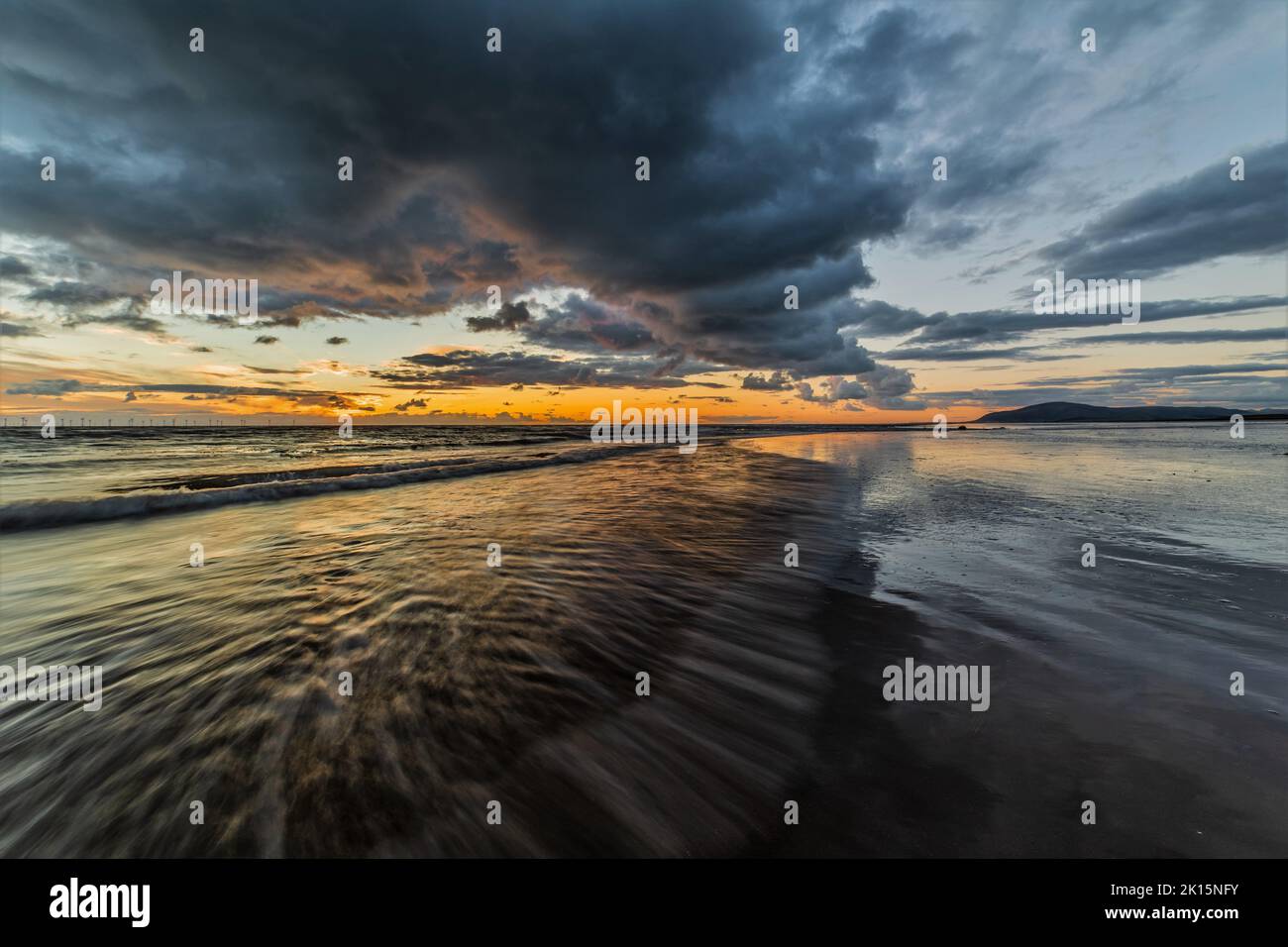 Sandy Gap, Walney Island, UK. 15thSeptember 2022. UK Weather. Sunset from Walney Island on the excellent Cumbrian Coast, view towards the distant Black Combe. Credit:greenburn/Alamy Live News. Stock Photo