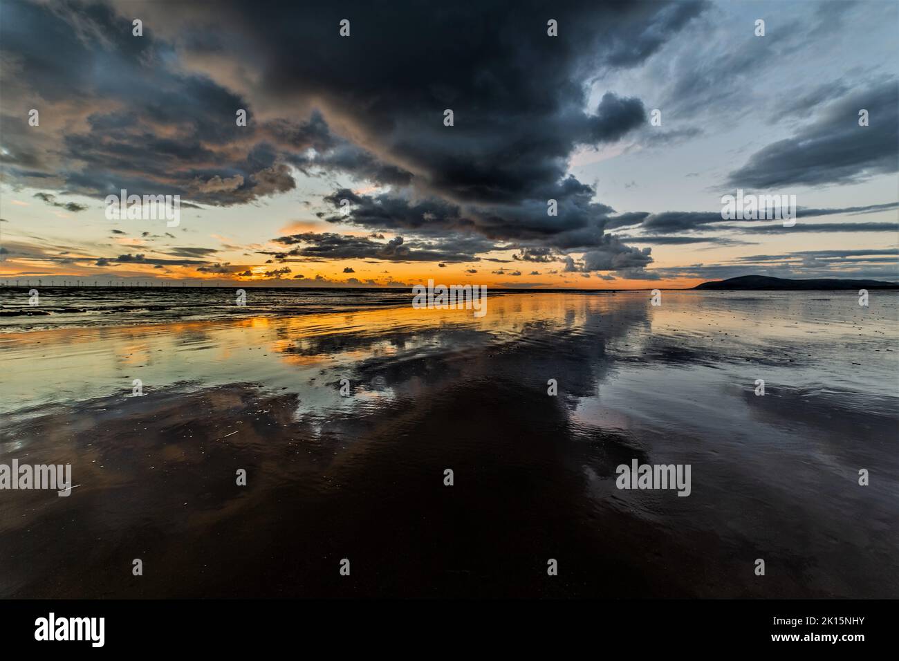 Sandy Gap, Walney Island, UK. 15thSeptember 2022. UK Weather. Sunset from Walney Island on the excellent Cumbrian Coast, view towards the distant Black Combe. Credit:greenburn/Alamy Live News. Stock Photo