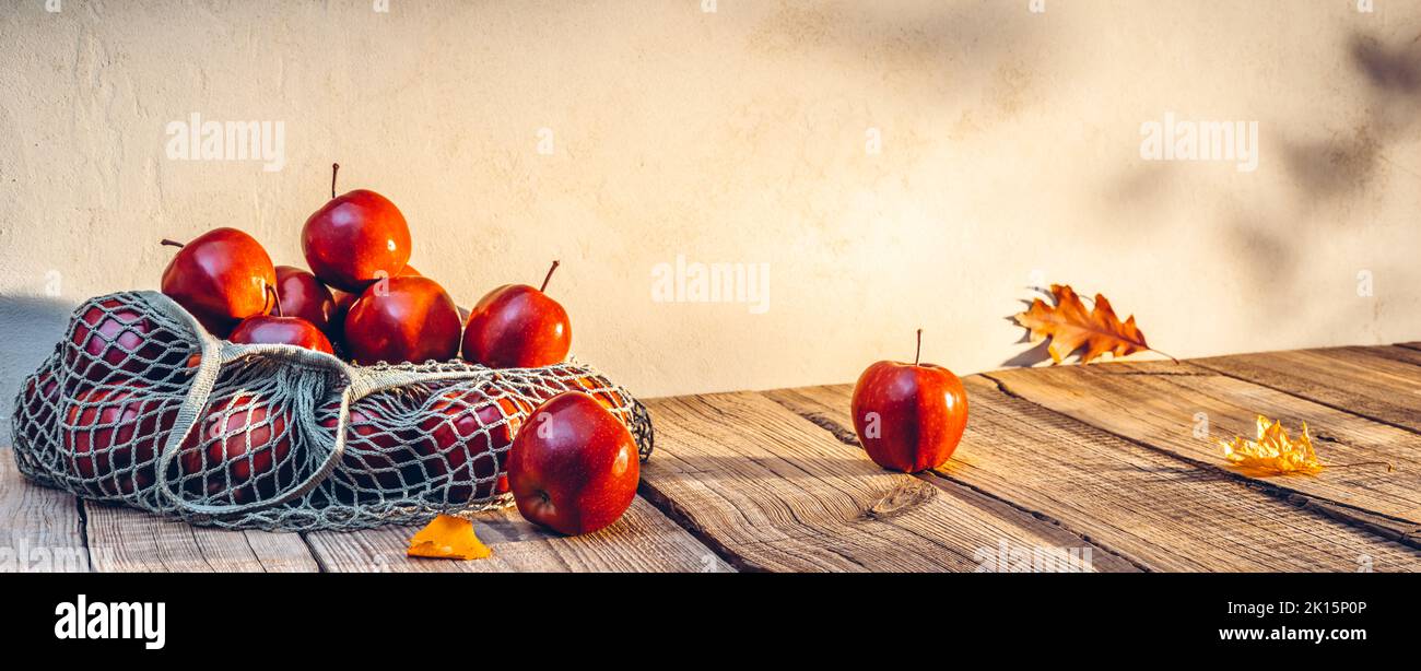 Red Apples In Eco Bag On Table - Autumn And Harvest Concept Stock Photo
