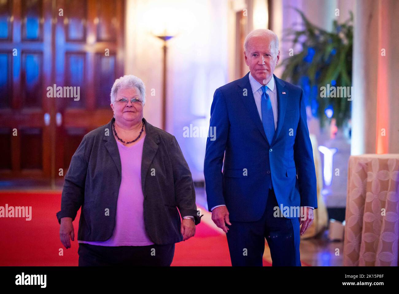 US President Joe Biden (R) along with Susan Bro (L) prepares to speak at the United We Stand Summit in the East Room of the White House in Washington, DC, USA, 15 September 2022. Bro is the mother of Heather Heyer, who was killed at the Unite the Right rally in Charlottesville, Virginia in 2017. Stock Photo