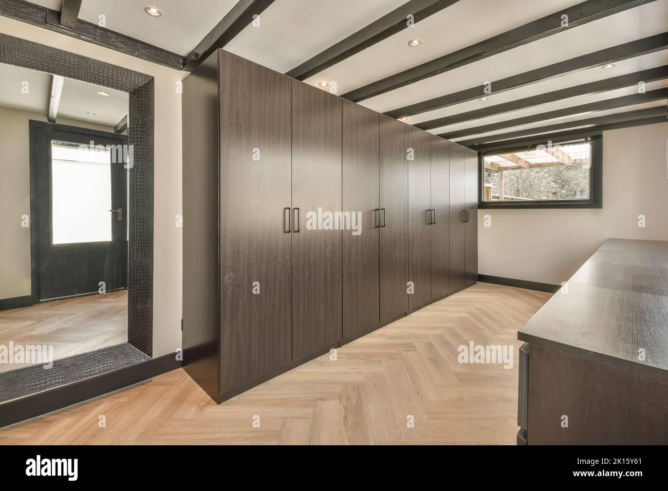 Interior of a modern house with clothes closets and file cabinets next ...