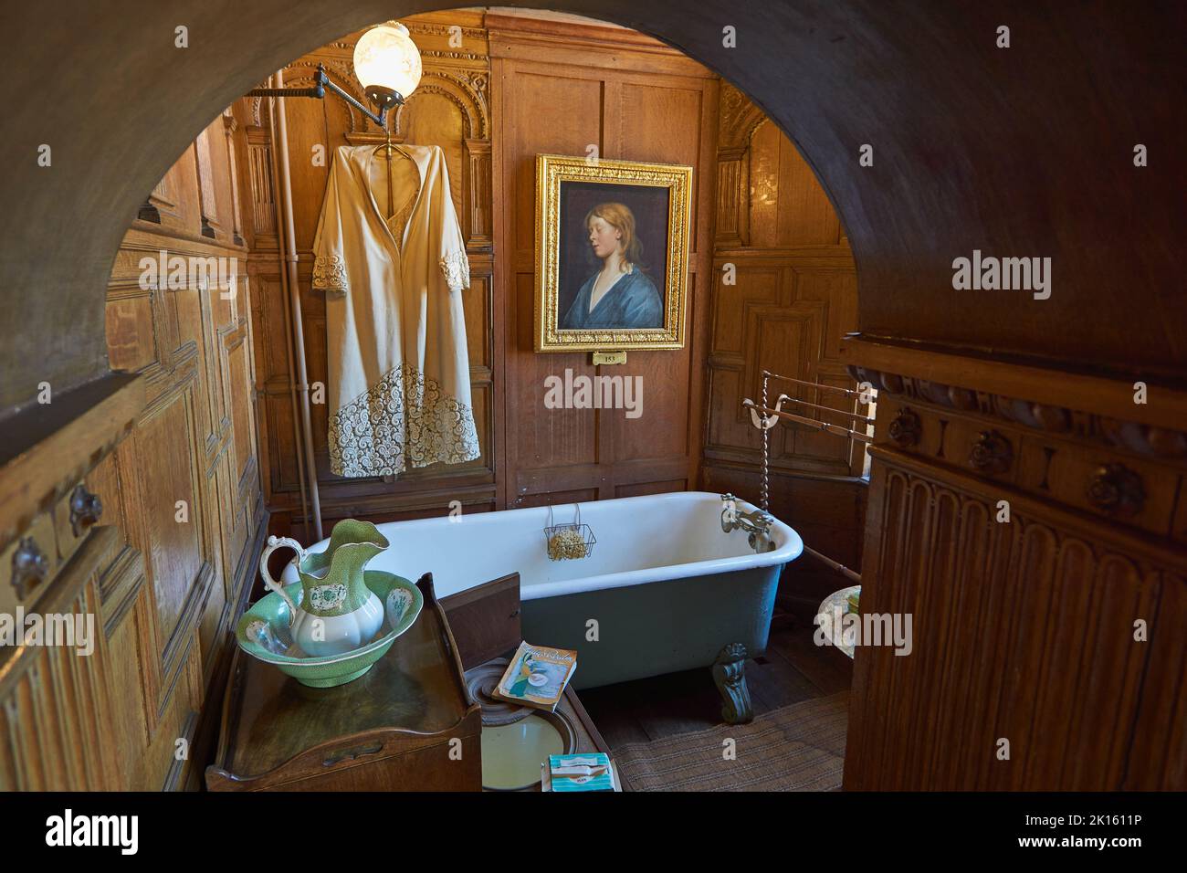 Interior of Burghley House - private bathroom with bathtub and toilet Stock Photo