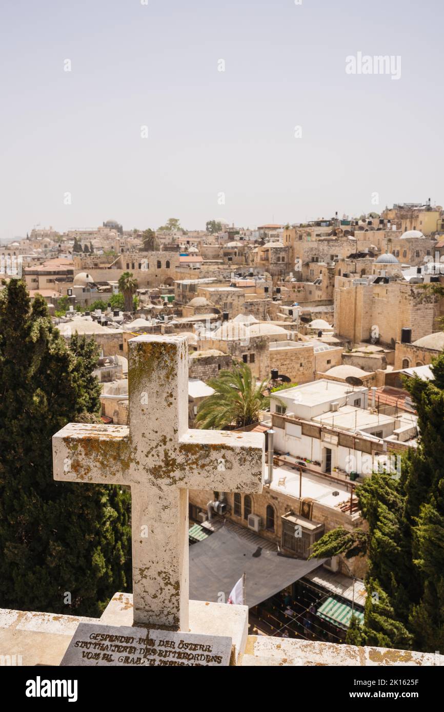 A cross overlooks the Old City of Jerusalem Stock Photo