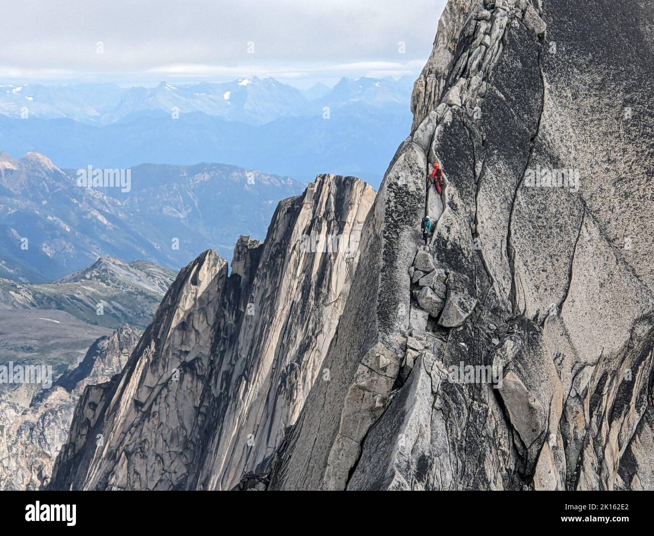 Climbers on Sheer Rock Face Pigeon Spire Stock Photo