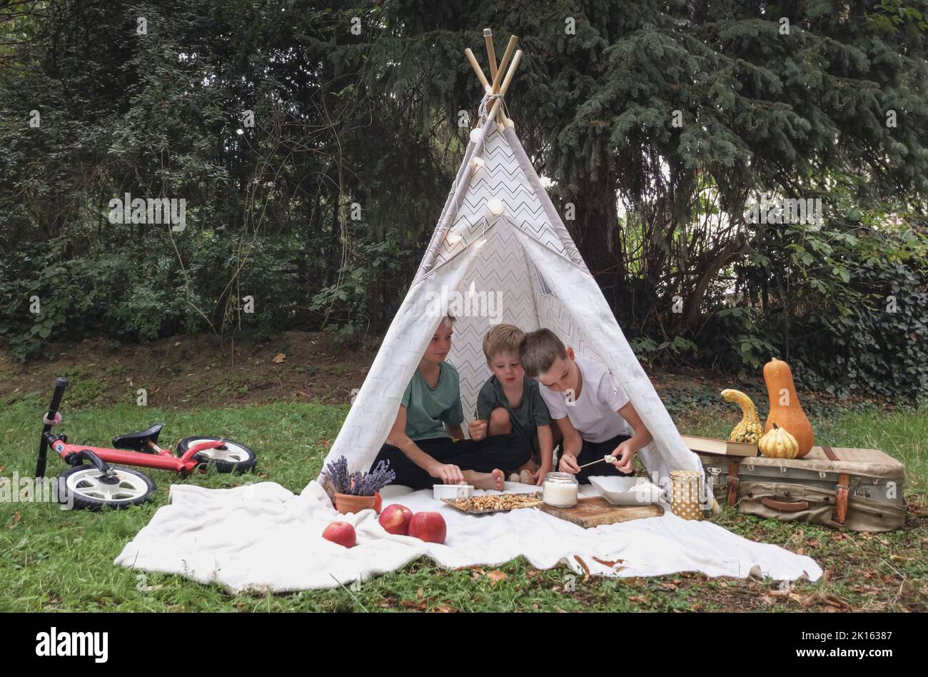 After the bike, the children eat treats and play Stock Photo Alamy