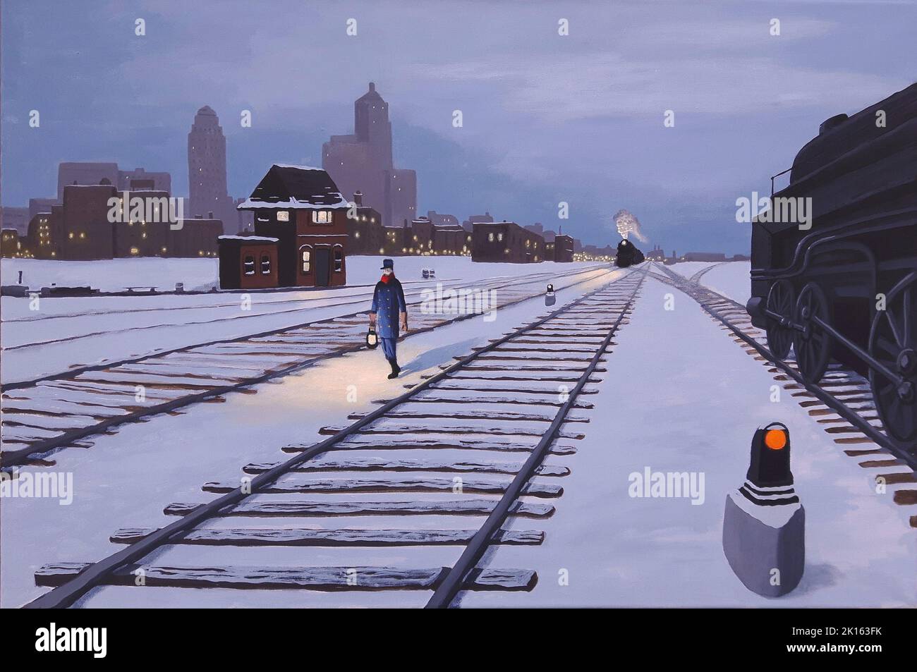 1940s scene of a railway worker holding a lamp and walking along the tracks on a winter evening in Toronto, Canada. Stock Photo