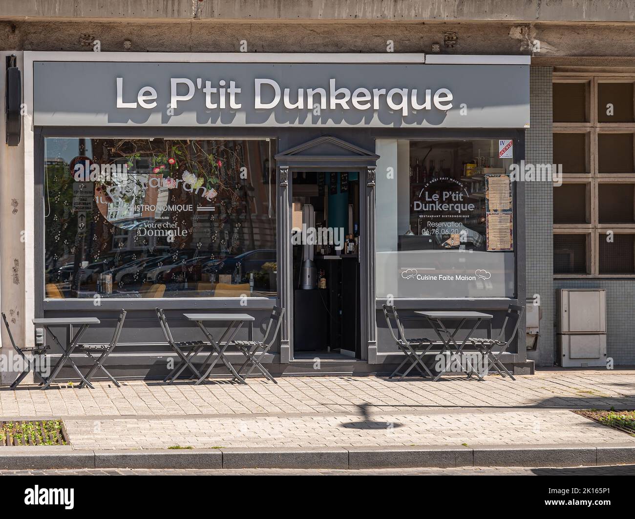 Europe, France, Dunkerque - July 9, 2022: Gray and white facade of famous restaurant gastronomic Le P'tit Dunkerque on Charles Valentin square. Stock Photo